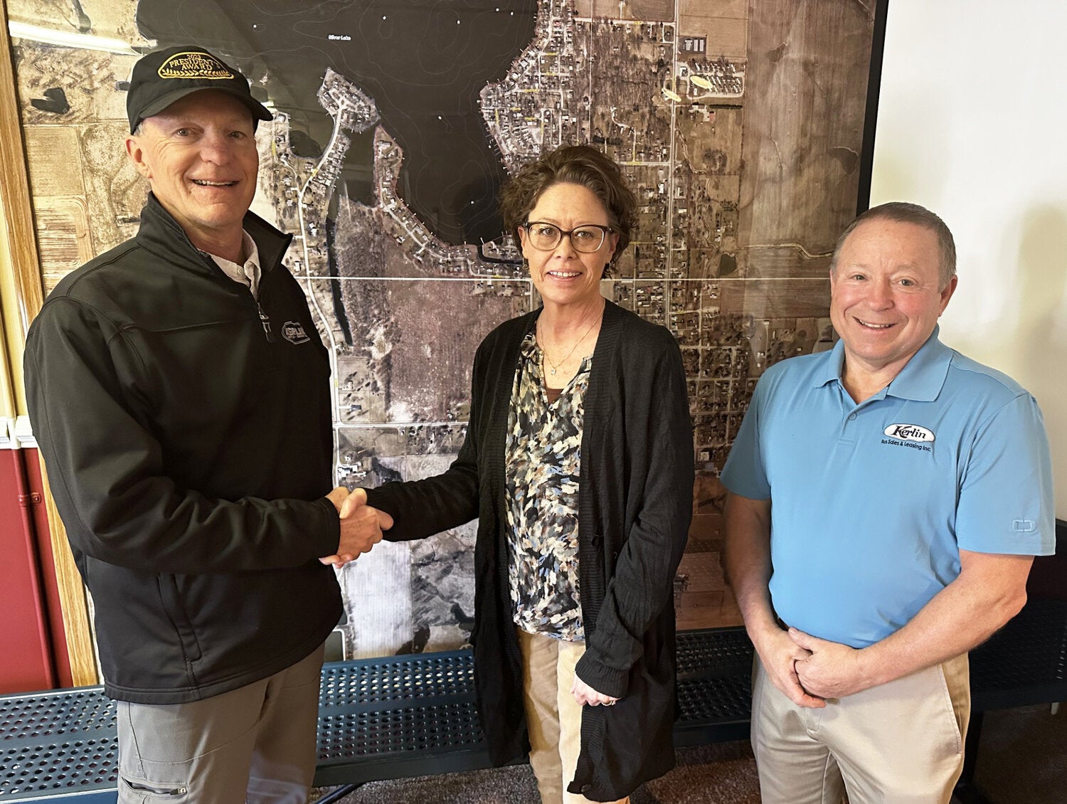 Rick & Diane Kerlin Donate over 3.5 acres - pictured Rick Kerlin, Silver Lake Clerk-Treasurer Tonya Conley, and Kerlin Bus President Clifford Zehr