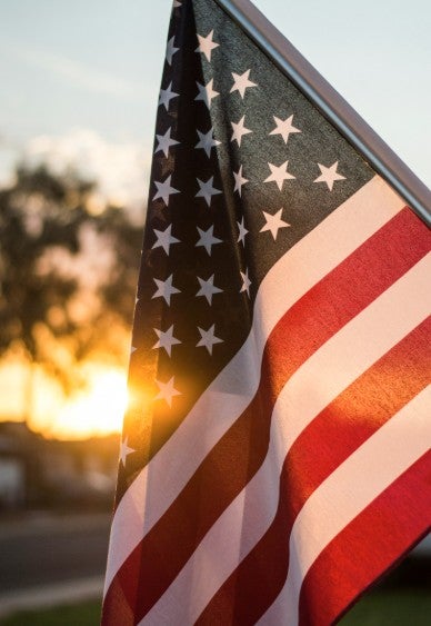 Ford dealership lot with flags